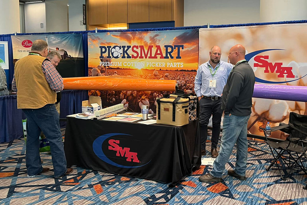 Picksmart Cotton Wrap by SMA representatives talking to customers at a convention